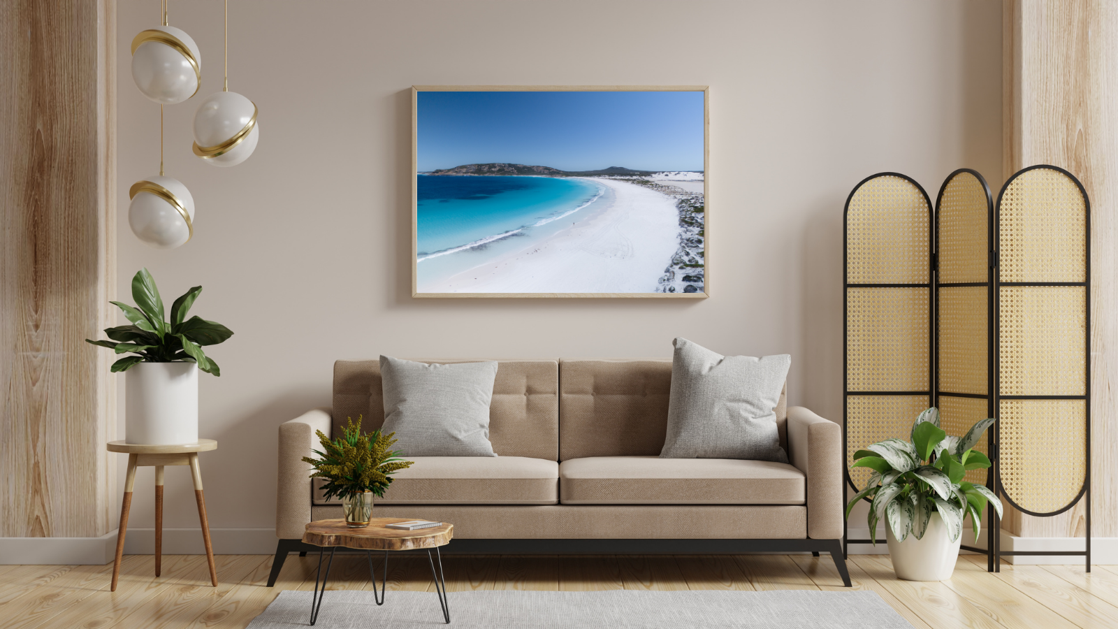 Modern living room with a beige sofa, decorative plants, and a large wall art of a beach. Lucky — Esperance pristine coastline aerial fine art print, Western Australia photography by Aqua Visions Photography